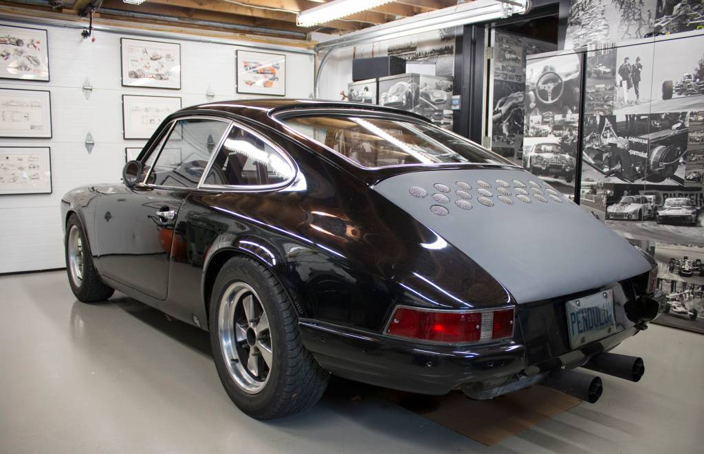 Elder's garage is lined with black and white prints that show the golden age of auto racing, from the 1930's to the 1960's. Clayton Seams, Driving